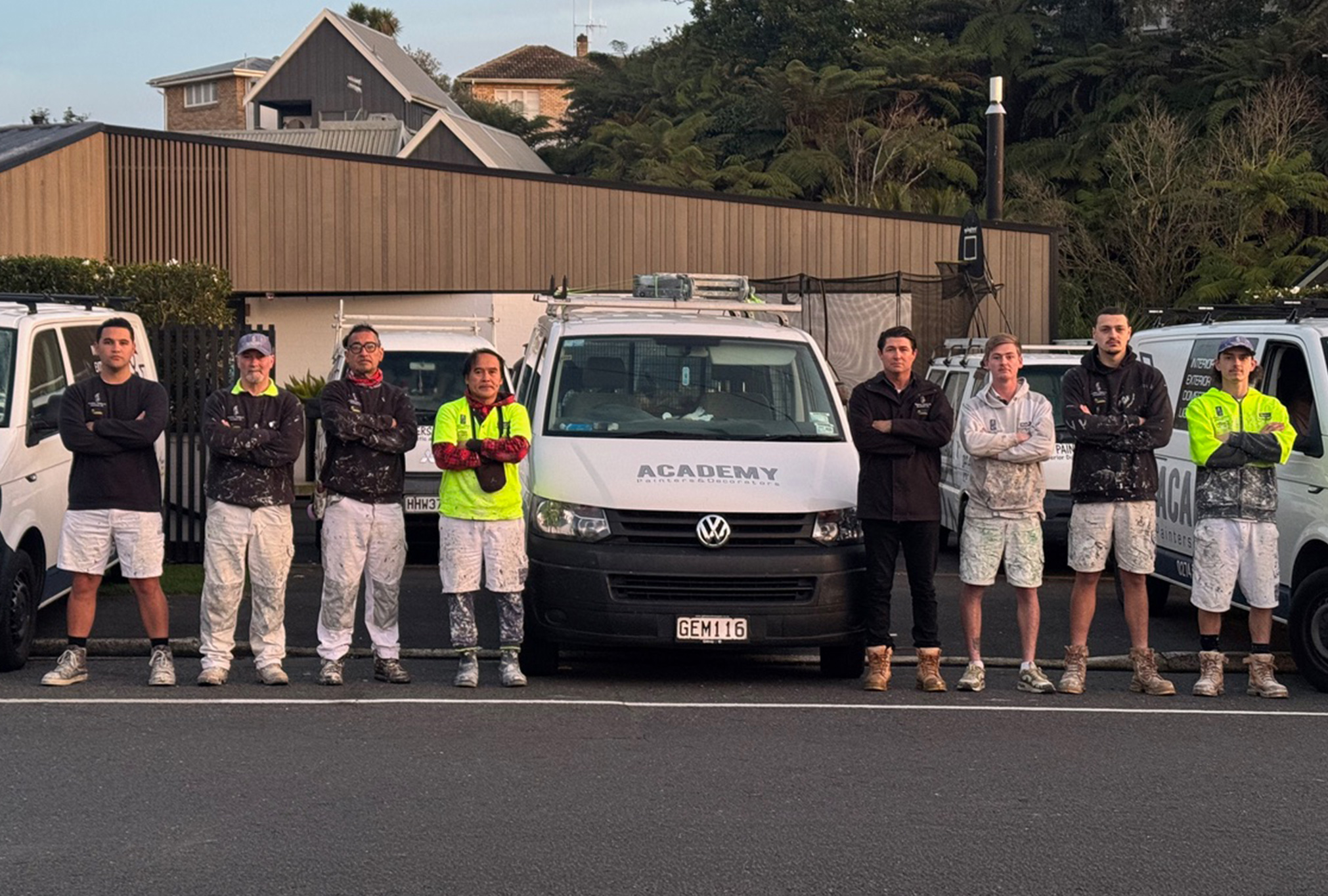 about-academy_painters Academy Painters team with company vans